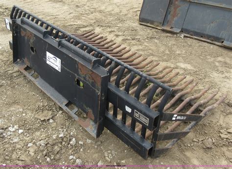 skid steer bucket rake|rock rake for skid steer.